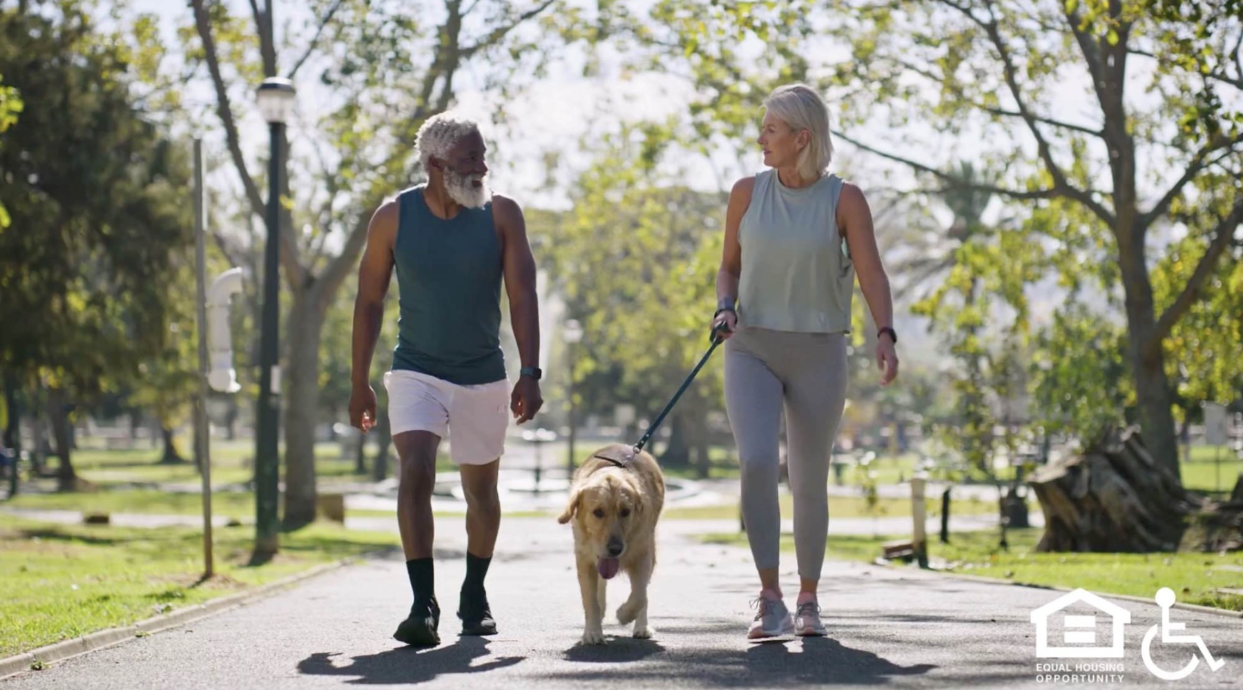 couple walking dog